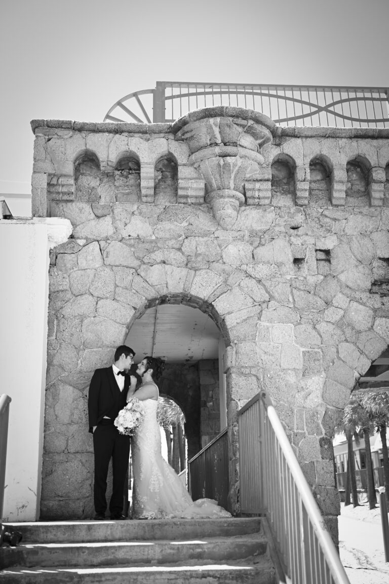 black and white photo of wedding couple in front of historic building in daytona beach.