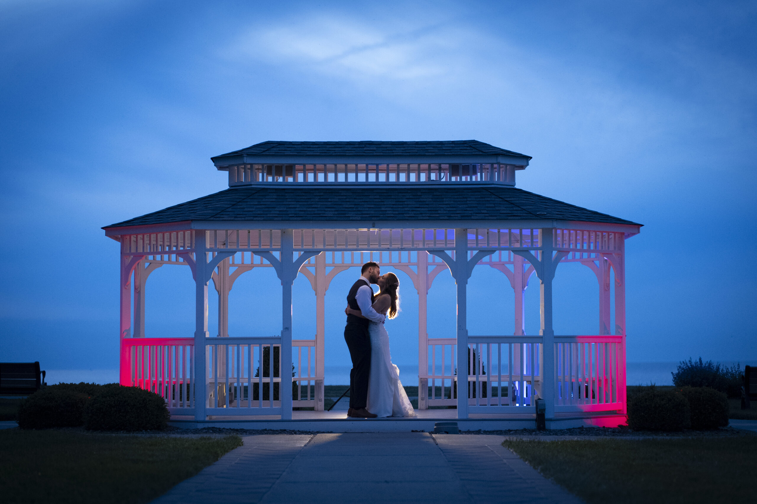 Blue Hour Photo of wedding couple under the Gazebo at The Lodge in Geneva