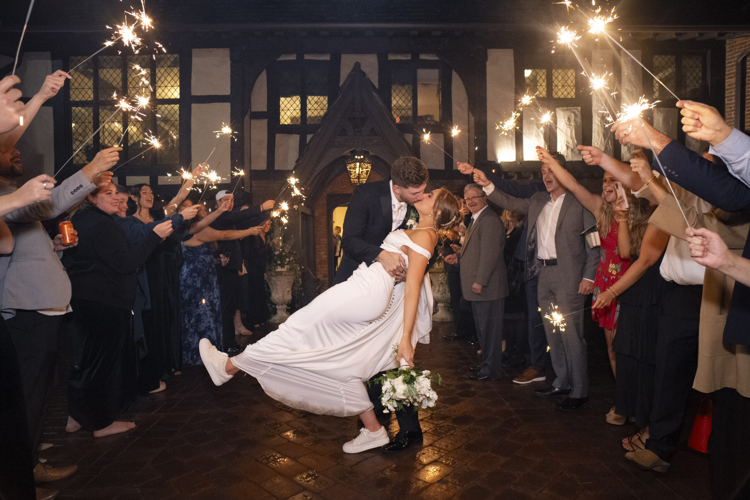 sparkler send off with groom dipping bride at Hillbrook club